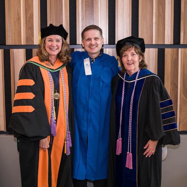 From left are Tricia Thomas, KCON dean and professor; Ben Weissenborn; and Janet Winter, KCON associate dean for undergraduate programs, at the college's recognition ceremony held August 5 on the Health Campus.