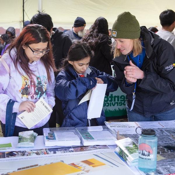 Students visit a booth during Blue-Green Career Fair