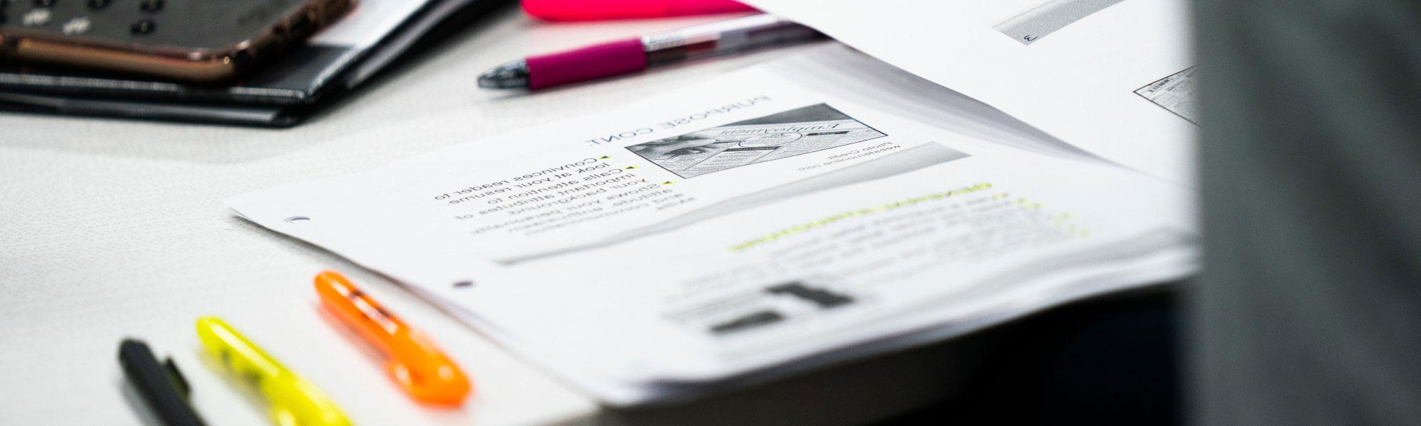 Image of classroom materials on a desk in front of a student.